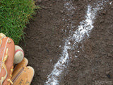baseball in glove on chalk line baseball in glove on chalk line