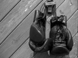 boxing gloves hanging on wood wall boxing gloves hanging on wood wall