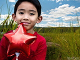 boy with red star balloon boy with red star balloon