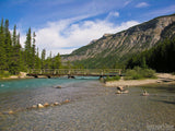bridge crosses a blue river in the mountains bridge crosses a blue river in the mountains