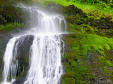 waterfall cascading over the mossy rocks waterfall cascading over the mossy rocks