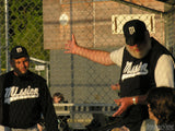coaching child in bull pen coaching child in bull pen