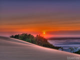 blowing sand in desert sunset blowing sand in desert sunset