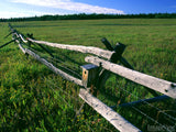 old wood and wire fence dividing pastures old wood and wire fence dividing pastures