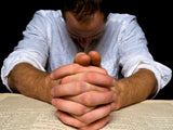 man with folded hands head bowed in prayer man with folded hands head bowed in prayer