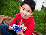 child with fourth of July plane child with fourth of July plane