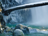 log with ice at waterfall frozen in time log with ice at waterfall frozen in time