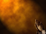 praying hands on a bronze background praying hands on a bronze background
