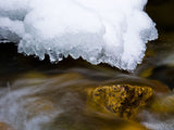 ice hangs over cold stream ice hangs over cold stream