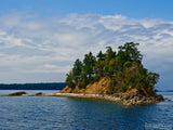 small island in the blue sea small island in the blue sea