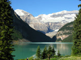 lake louse trees near water and mountains lake louse trees near water and mountains