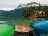 two canoes frame the still mountain lake two canoes frame the still mountain lake
