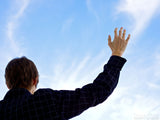 man lifting hand in worshiping him man lifting hand in worshiping him