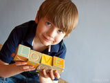 boy with blocks spells love boy with blocks spells love