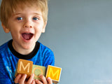 happy boy on mother's day with blocks happy boy on mother's day with blocks
