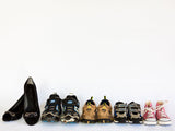 moms and kids shoes in a row on white background moms and kids shoes in a row on white background