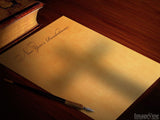 new years list with shadow of cross on paper new years list with shadow of cross on paper