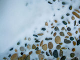 pebbles in a snowy background pebbles in a snowy background