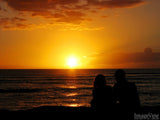 a couple enjoys the perfect sunset a couple enjoys the perfect sunset