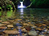 rocks under water and punchbowl falls in the background rocks under water and punchbowl falls in the background