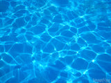 ripples of light in clear blue water ripples of light in clear blue water