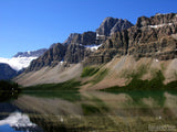 rugged mountain reflects in clear lake rugged mountain reflects in clear lake