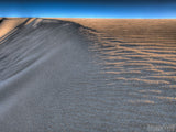 on top of the sand dune on top of the sand dune