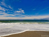 sea foam blue skies and sandy beach sea foam blue skies and sandy beach