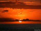 sun going down on the ocean horizon sun going down on the ocean horizon