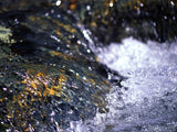 water sliding over the rocks below water sliding over the rocks below
