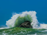 green ocean wave crashes over the rocks green ocean wave crashes over the rocks