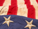 closeup on stars on old us flag closeup on stars on old us flag