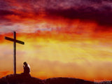 man kneeling at a cross during sunset man kneeling at a cross during sunset