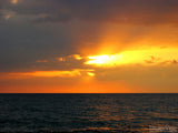 sunsets on the dark ocean water sunsets on the dark ocean water