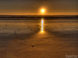 a sandy beach at sunset a sandy beach at sunset