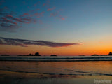 sunset on a sandy shore line sunset on a sandy shore line