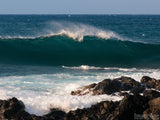 surf wave crests near the rocky shore surf wave crests near the rocky shore