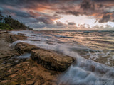 waves crashing on rocks at sunset waves crashing on rocks at sunset