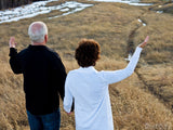 man and wife with hands raised man and wife with hands raised