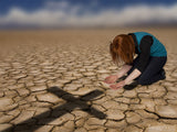 woman kneeling by cross shadow woman kneeling by cross shadow