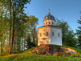 chapel on a hill at sunset