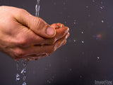hands catching pouring water
