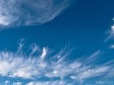 cloud streaks on blue background