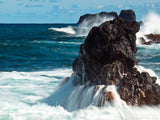 crashing waves over the out cropped rocks