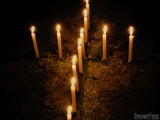 cross of glowing candles