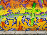 cross on a graffiti wall