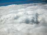 above the dense white cloud layer