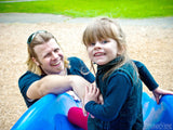 father and daughter on a slide