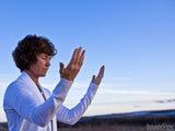 woman lifting hands free to worship