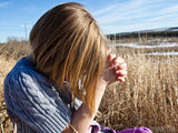 girl praying in a field